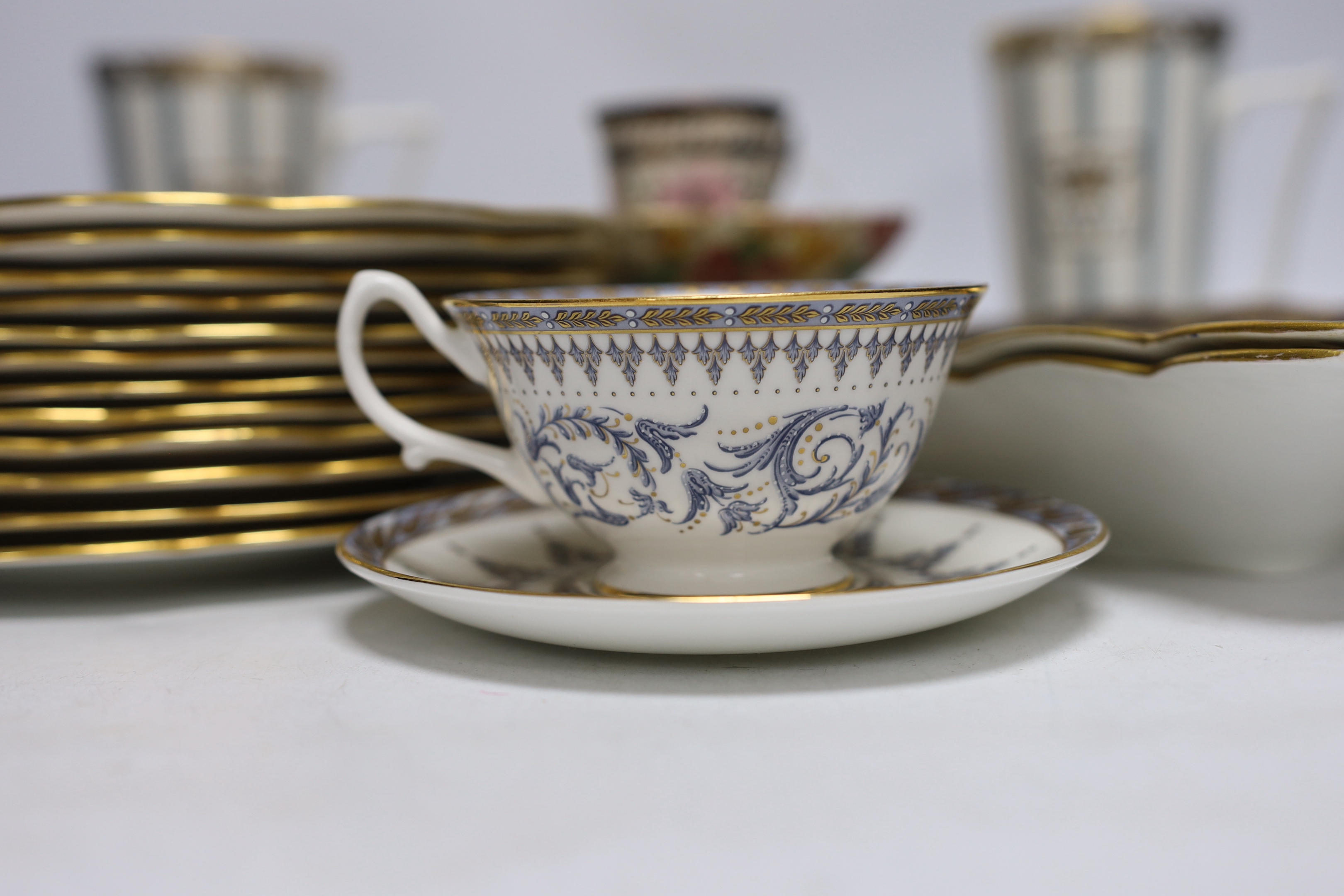 An Aynsleys part dessert service and other tea wares including a pair of commemorative mugs